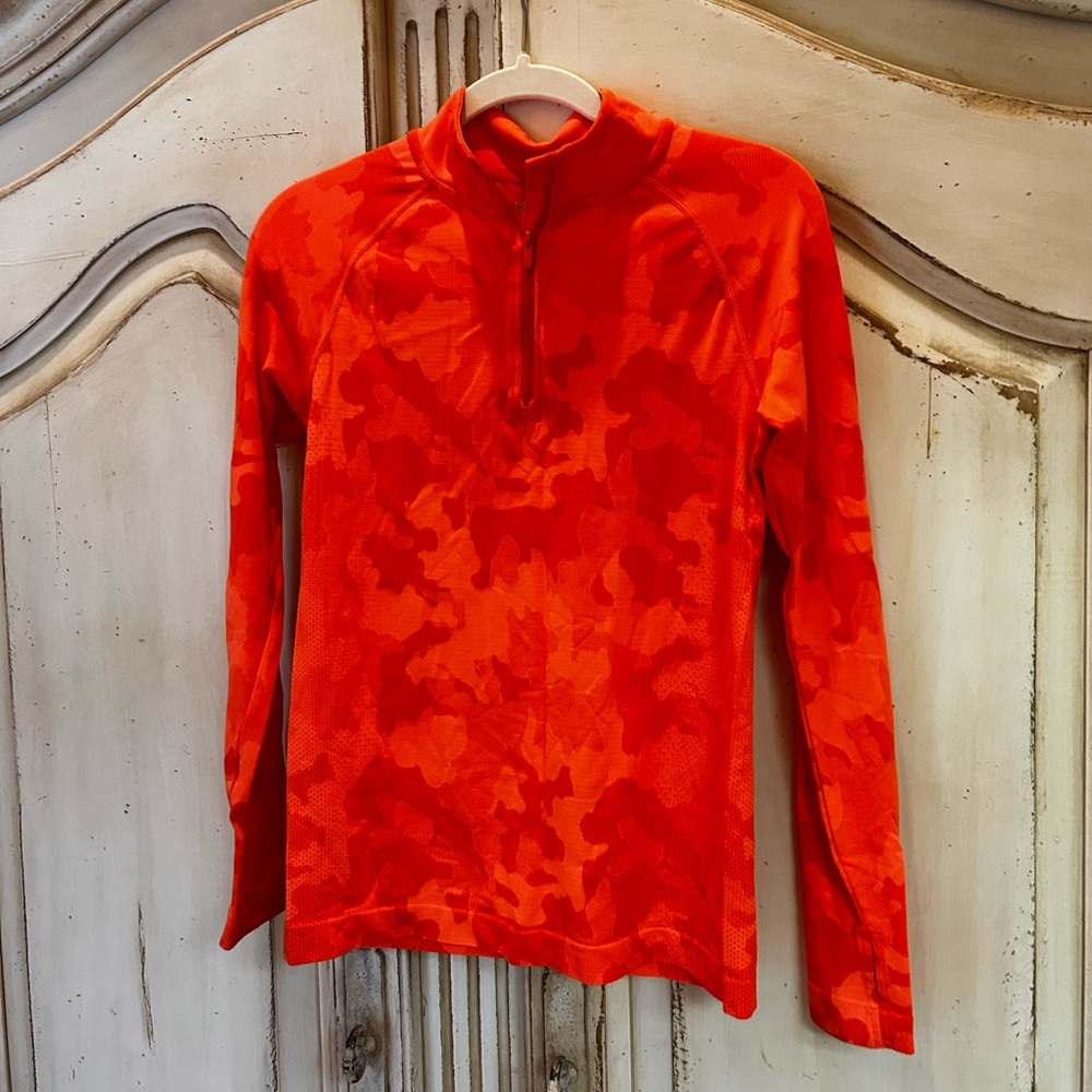 Worn once! All In Motion 1/4 zip orange camo print long sleeve pullover.